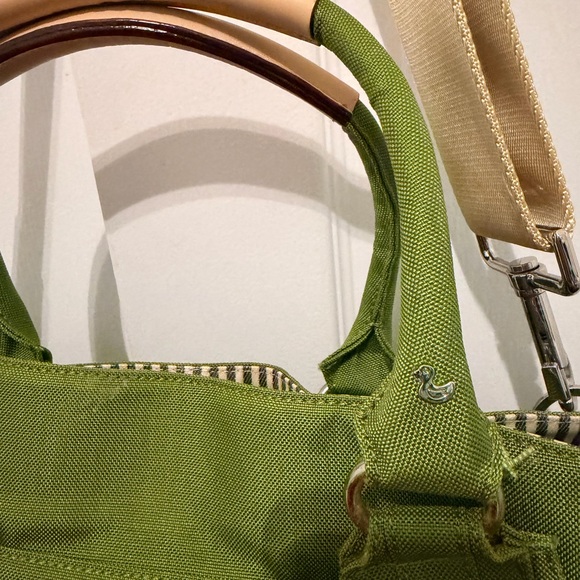 Danzo Diaper Bag in Green and tan with multiple compartments inside - Picture 2 of 11